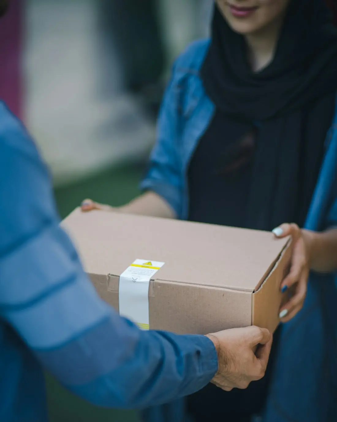 A parcel being handed over to a customer