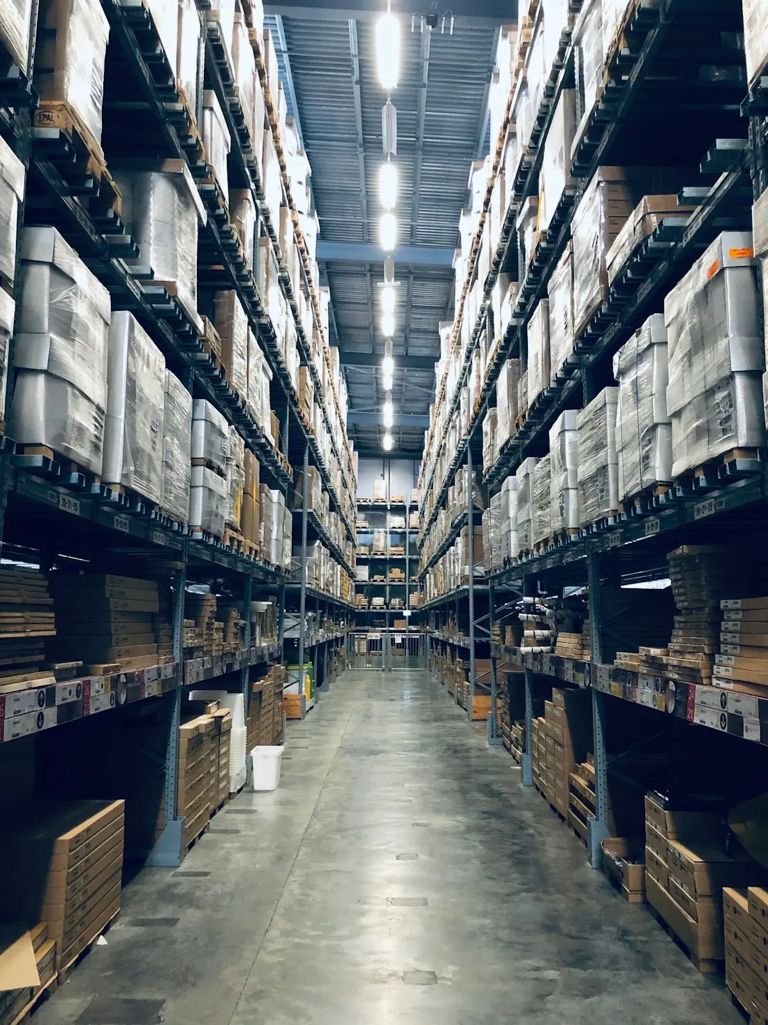Warehouse aisle stacked with cargo